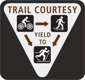 A graphic of a fat bike trail courtesy sign.