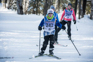 Kids working hard during a cross country ski race. Photo credit: Thom Morrissey